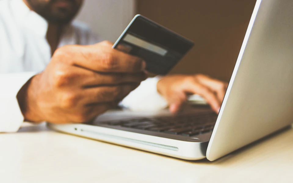 Business owner using a corporate bank card online
