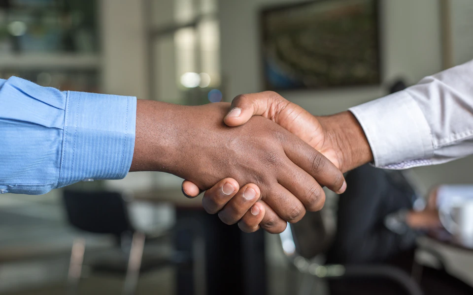 Business partners shaking hands after company formation in Dubai