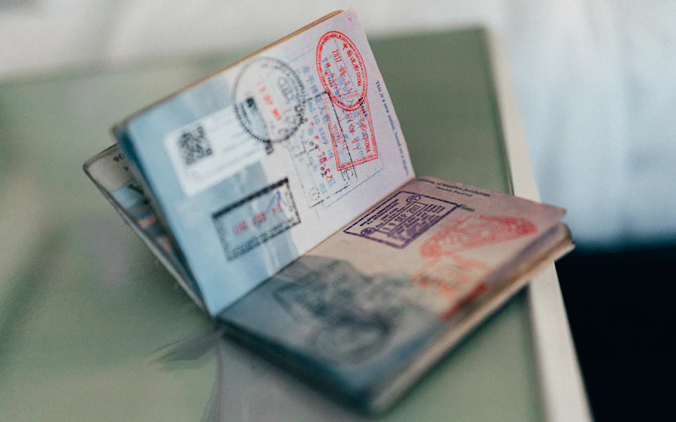 Passport with visa stamps for a UAE investor visa